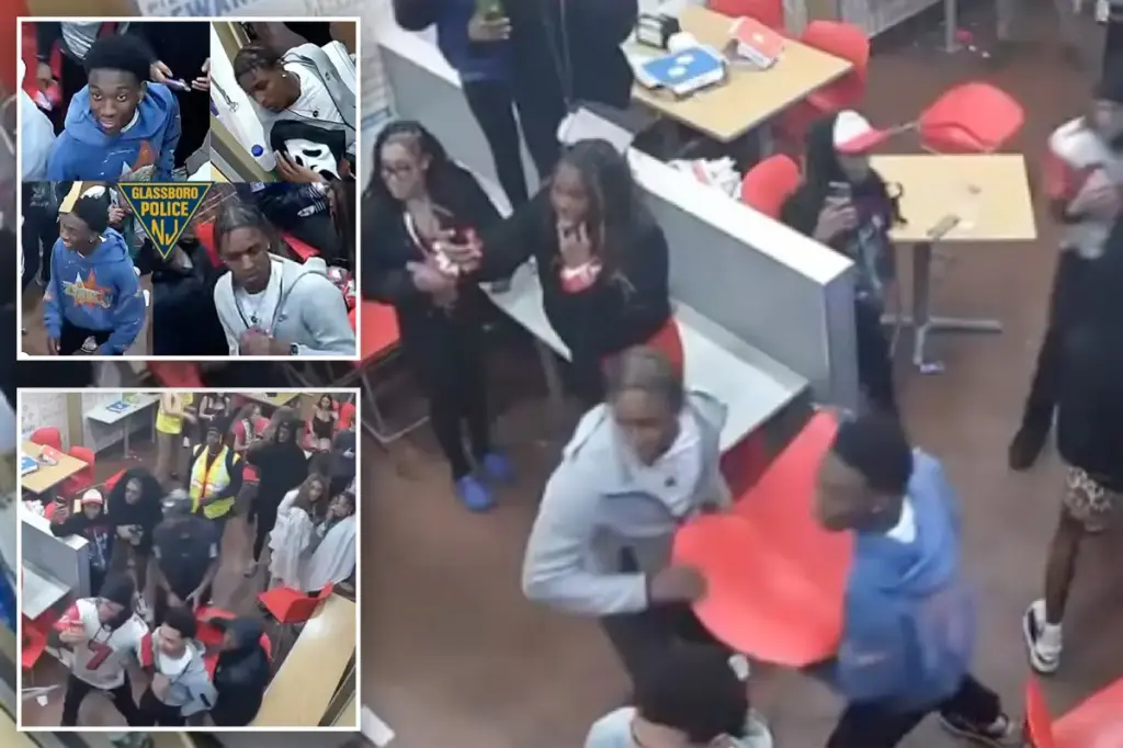 Fight breaks out at Domino's as suspects throw chair and hit officer.