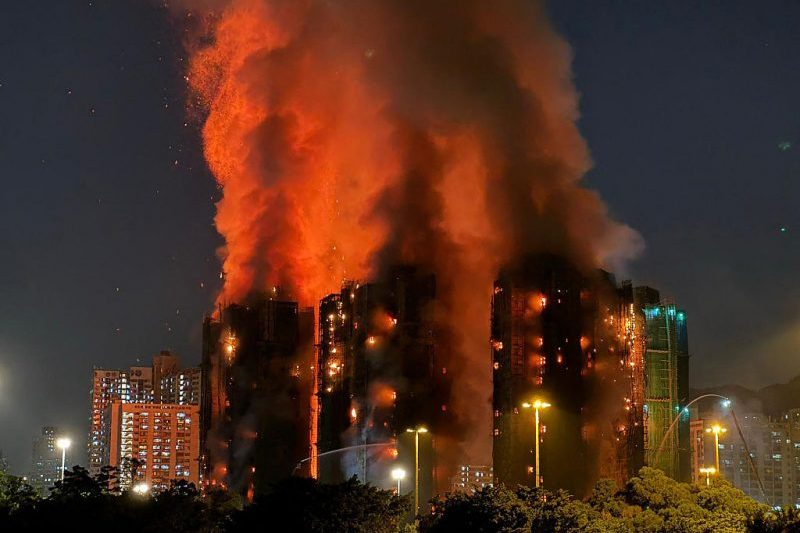 Fire consumes residential buildings in Hong Kong, resulting in at least 36 deaths.