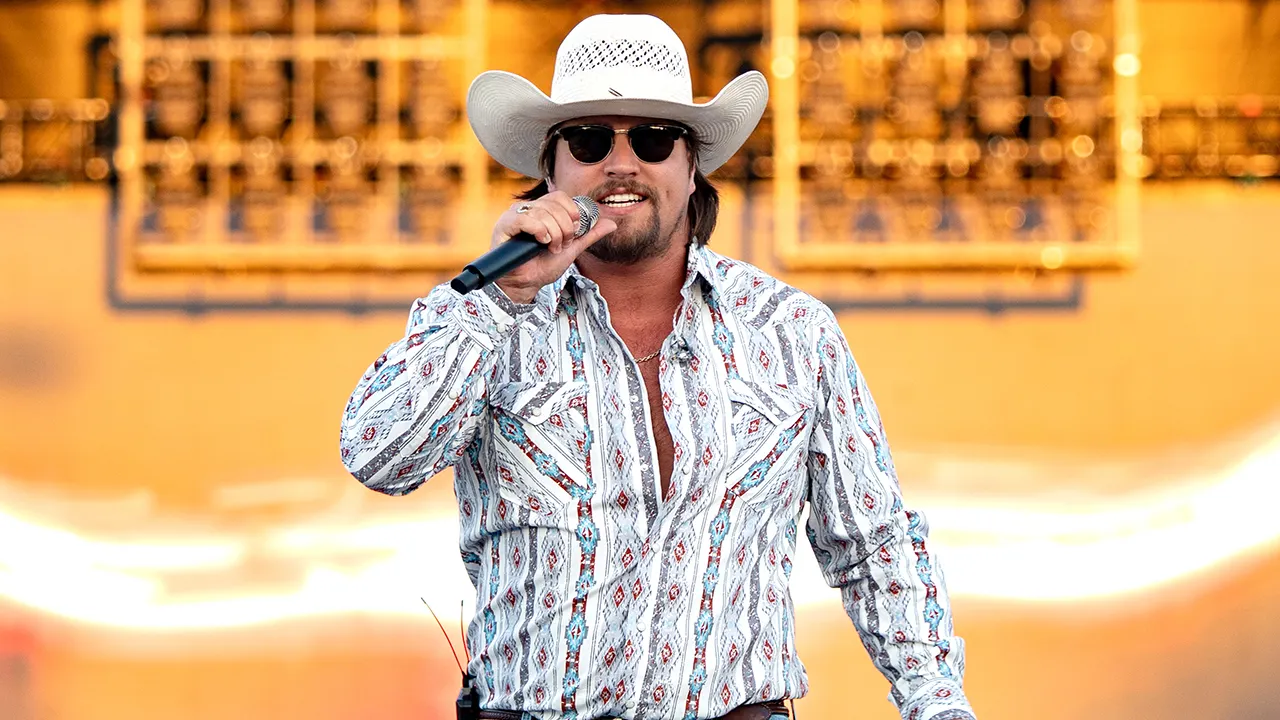 Gavin Adcock tumbles off stage but continues singing in performance clip