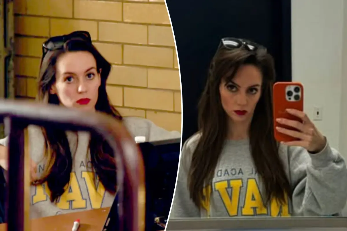 Jordon Hudson sports a navy sweater for Halloween.