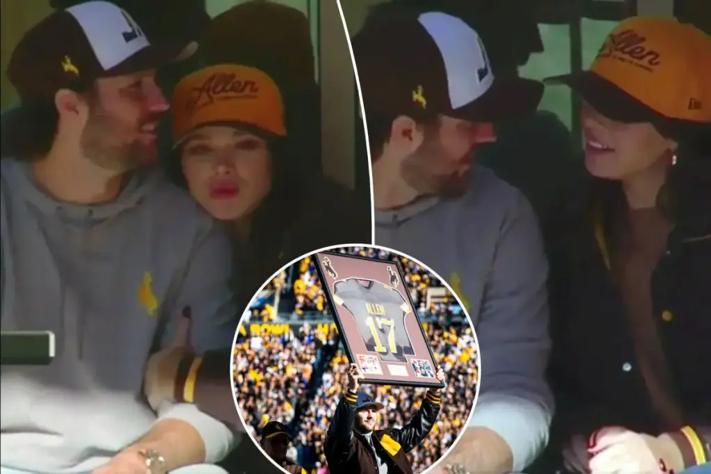 Josh Allen and Hailee Steinfeld share a warm moment at the quarterback's jersey retirement event