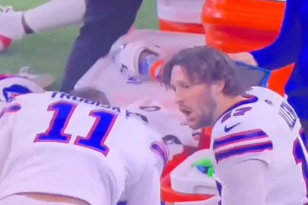 Josh Allen hits his helmet in frustration after the Bills suffer a tough loss.