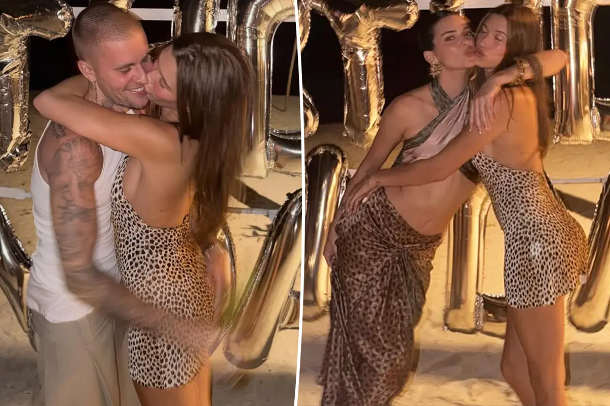 Justin Bieber and his wife Hailey share a kiss at Kendall Jenner's celebration
