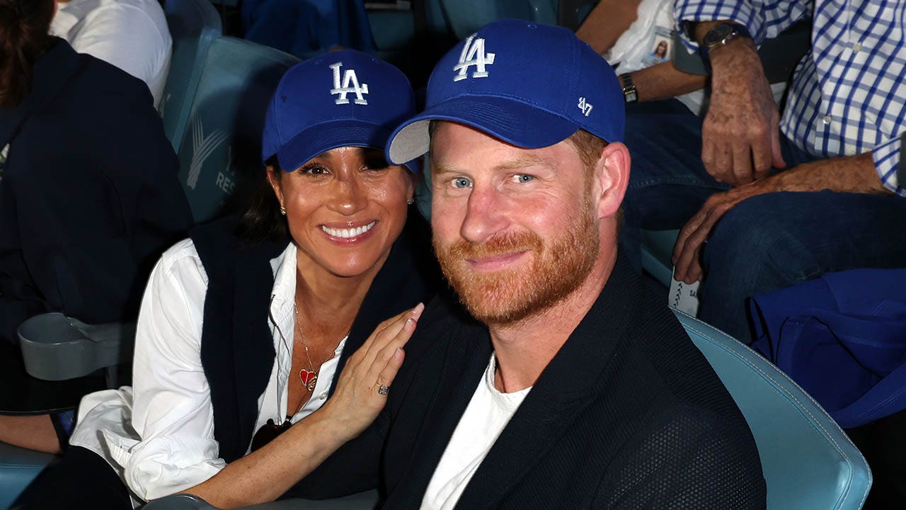 Meghan Markle and Prince Harry mark the Dodgers' World Series victory with affectionate displays.