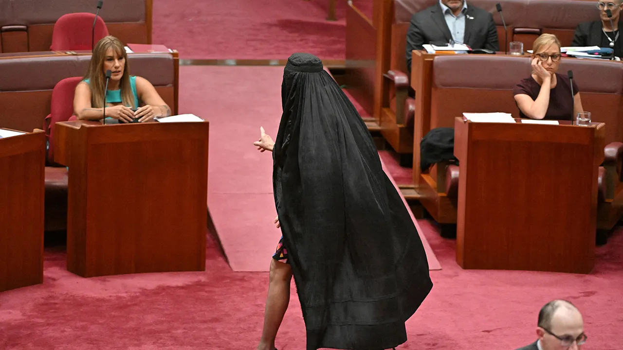 Parliament chaos in Australia as Pauline Hanson dons burqa in the Senate