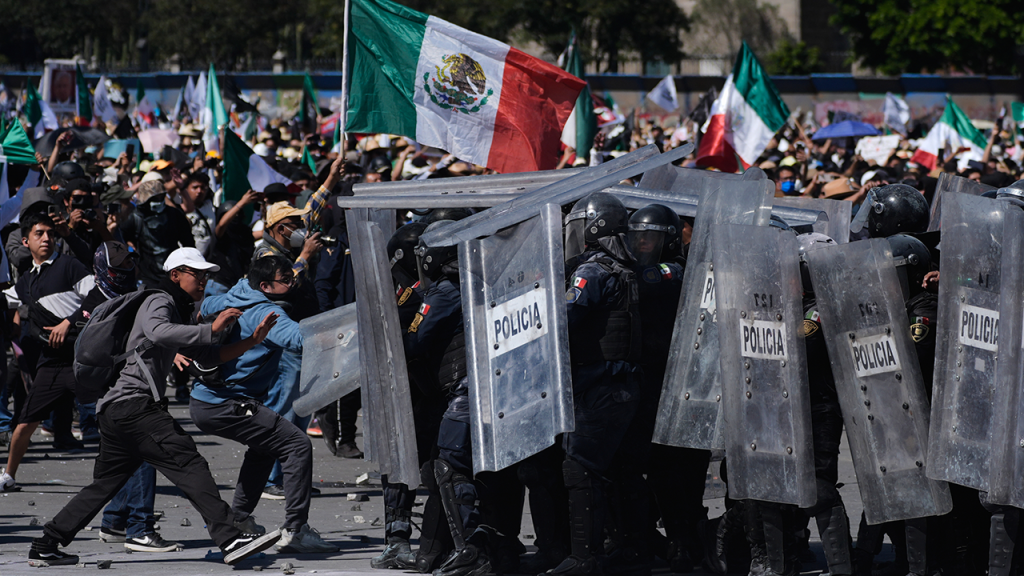 Protesters in Mexico City clash with police during a violent demonstration against the government