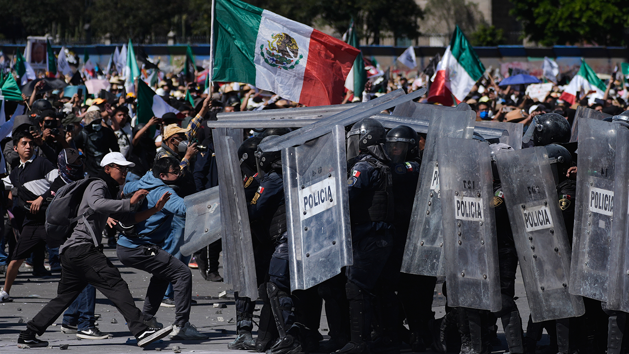 Protesters in Mexico City clash with police during a violent demonstration against the government