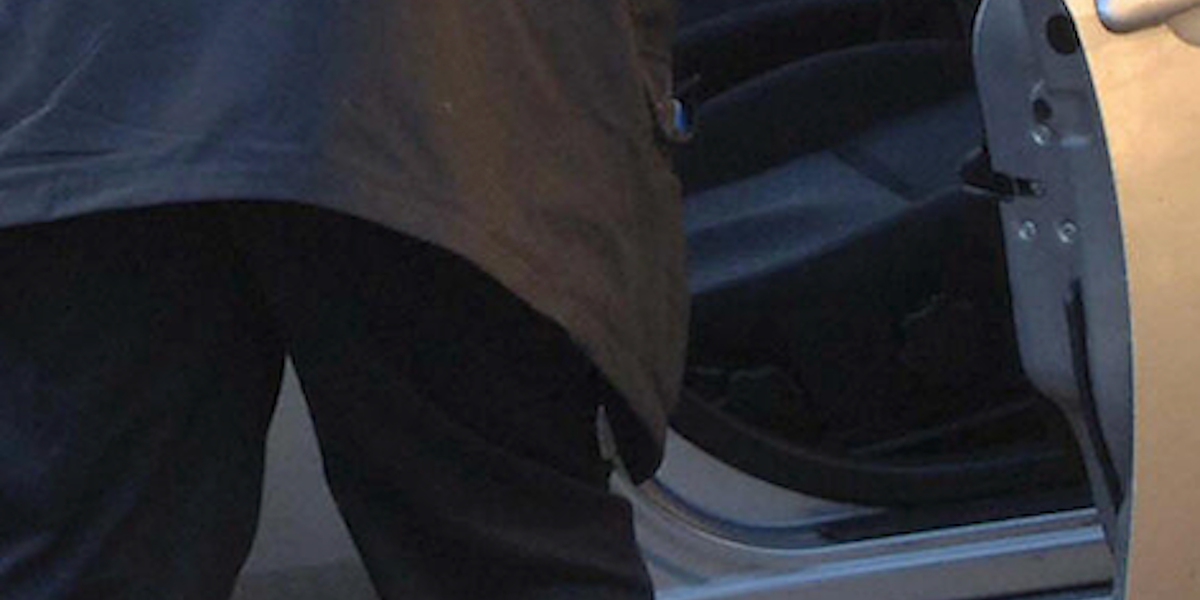 Video: Woman easily removes male intruder from her car and throws him to the ground, as her astonished husband looks on