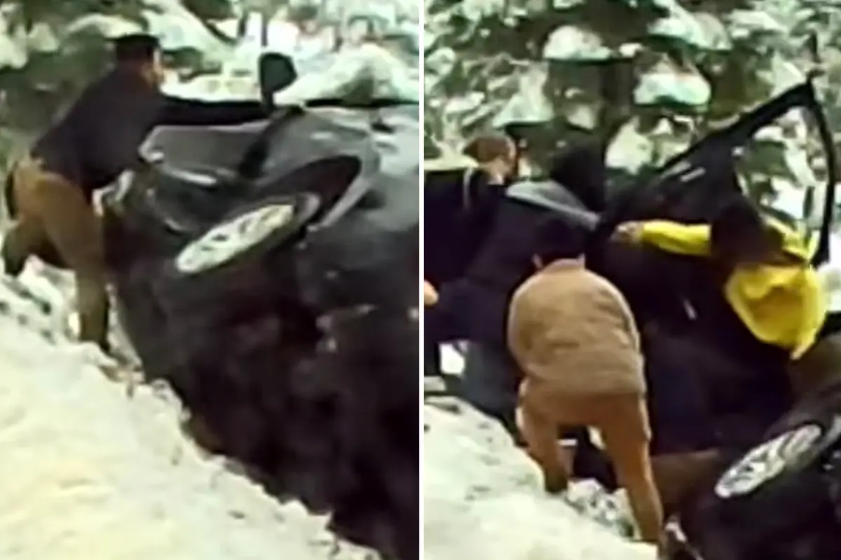 Air Force sergeant rescues couple from SUV hanging off the highway: video