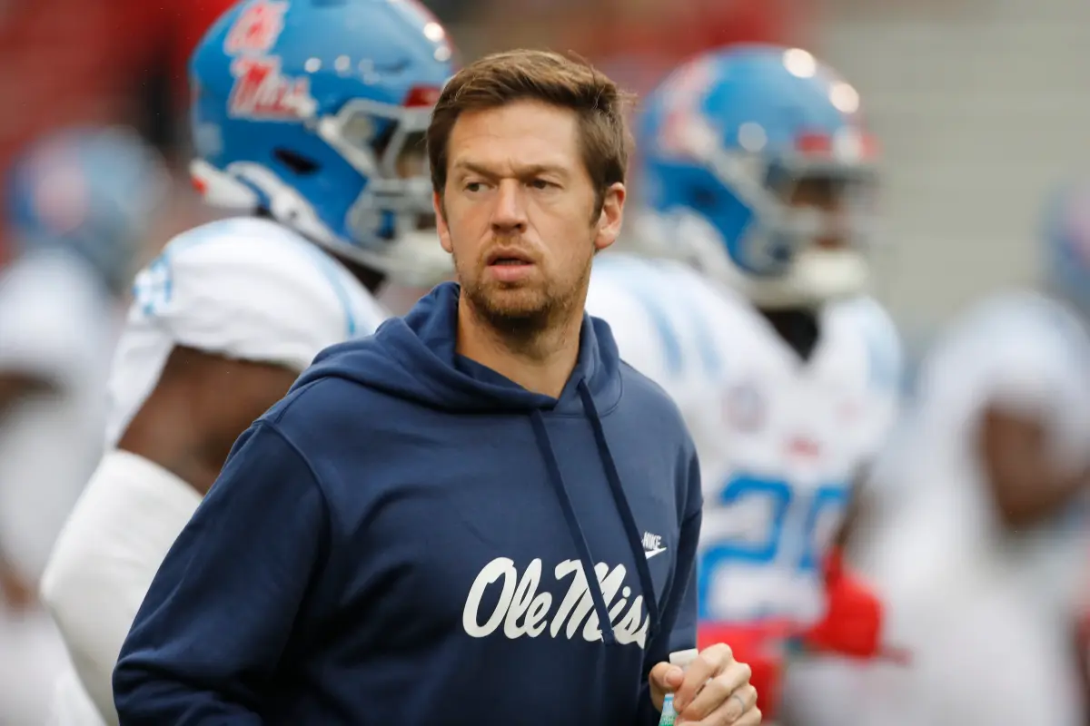 Charlie Weis Jr. remains at Ole Miss for the CFP even after joining Lane Kiffin at LSU.