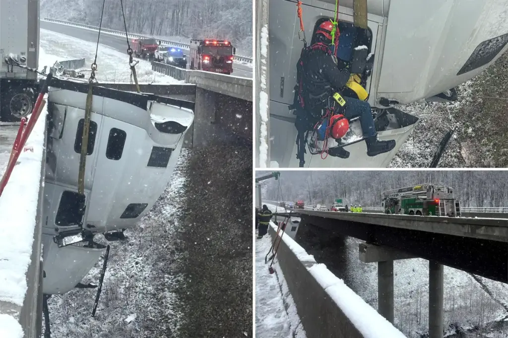 Driver saved after hanging 100 feet above the ground on a West Virginia highway