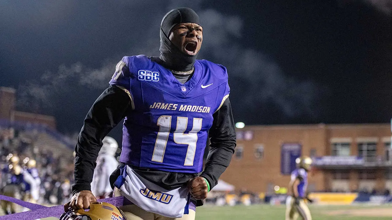 James Madison supporters toss snowballs, almost striking a Troy player during the game