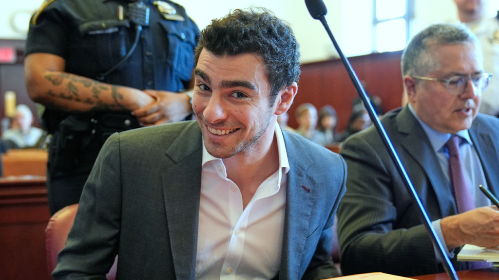 Luigi Mangione grins in court while attorneys request to block evidence.