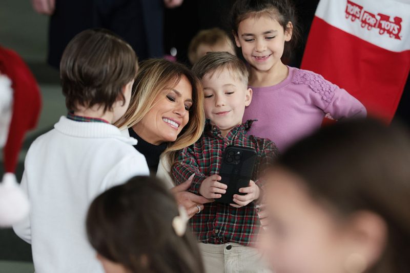 Melania visits a charity event for Toys for Tots, spreading joy and gifts to disadvantaged kids.
