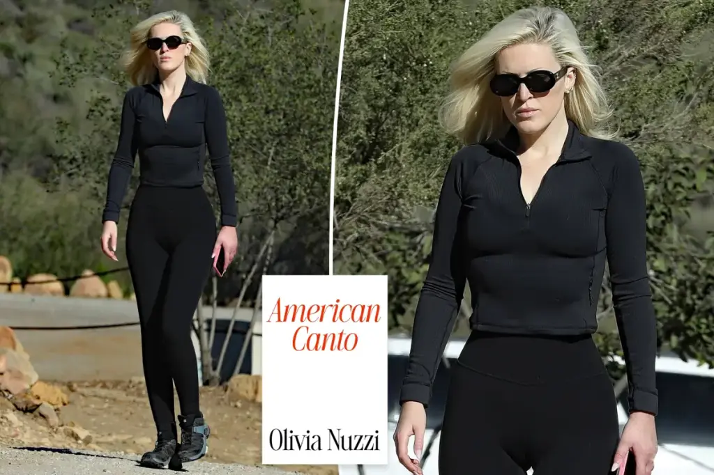 Olivia Nuzzi remains calm during a paparazzi photo session after voicing concerns about being chased.
