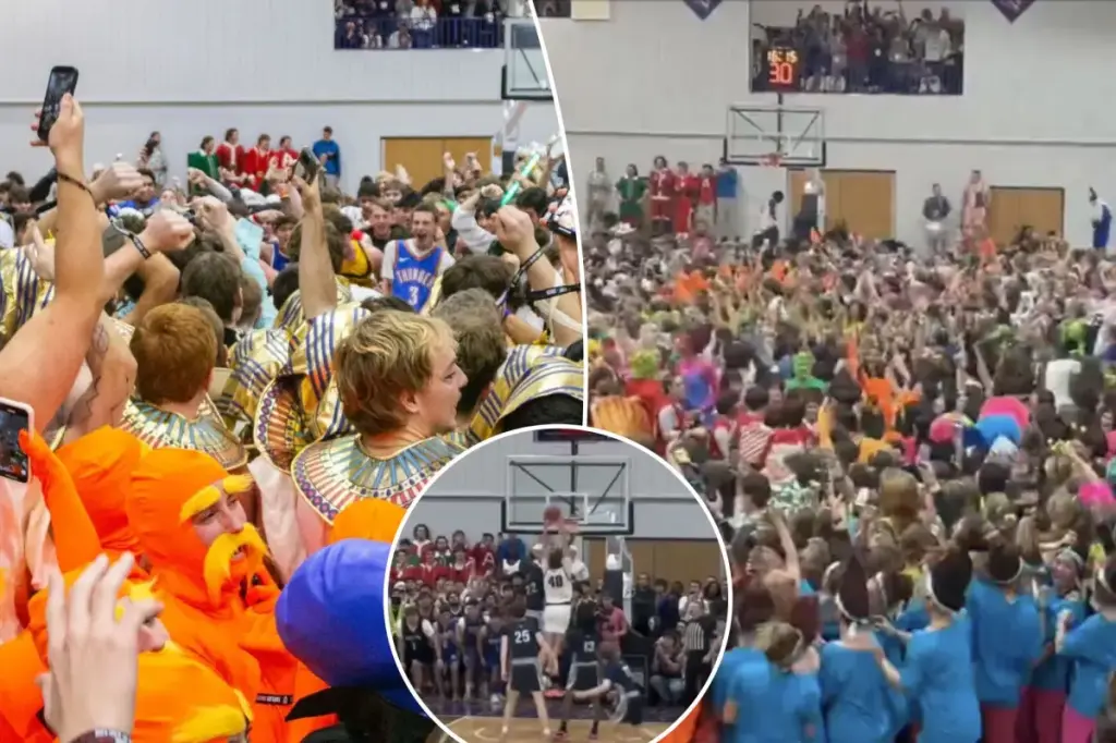 Taylor University supporters rush onto the basketball court during the well-known 'Silent Night' Christmas tradition.