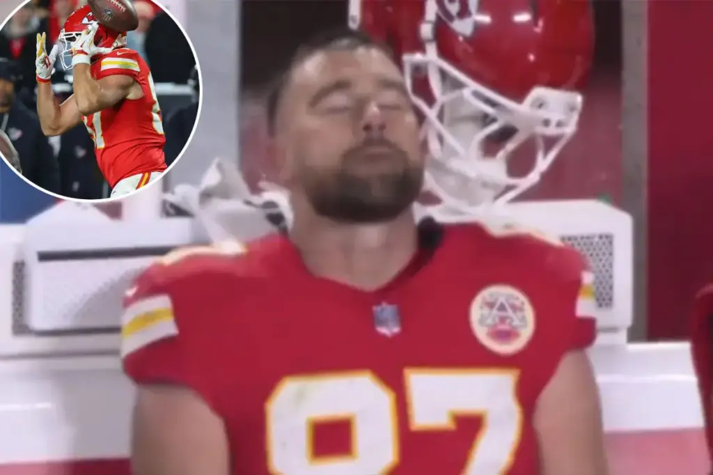 Travis Kelce appears devastated on the sideline following a critical drop in the Chiefs' defeat.