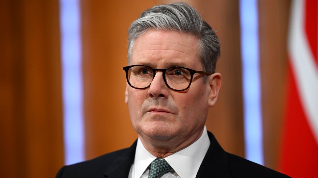 UK Prime Minister faces backlash for embracing returned activist due to disputed statements.