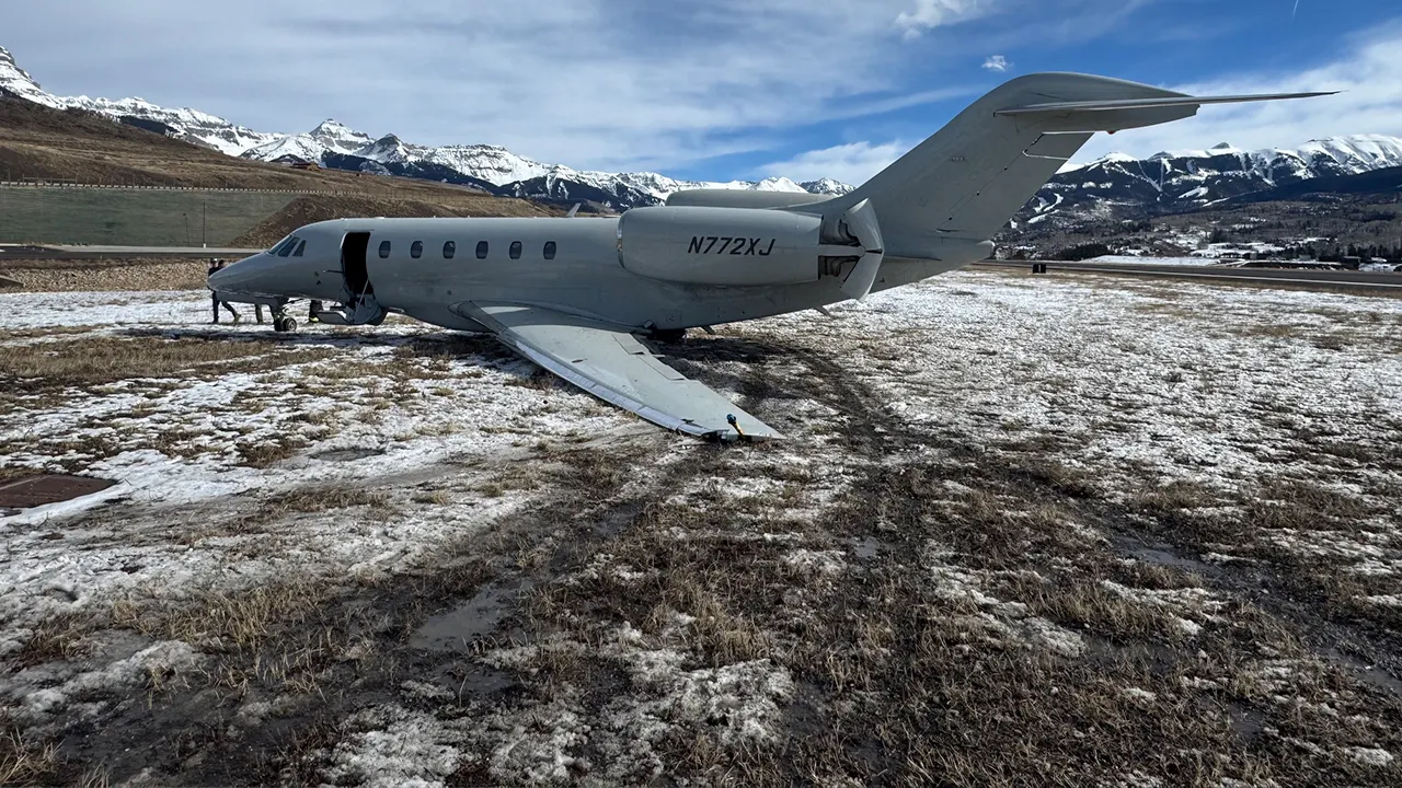 Business jet slides 300 yards off Colorado runway during crosswind situation