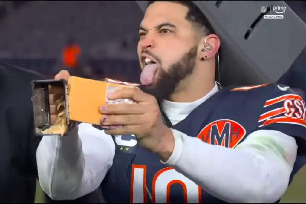 Caleb Williams mocks the Packers by grating cheese after the Bears' victory.