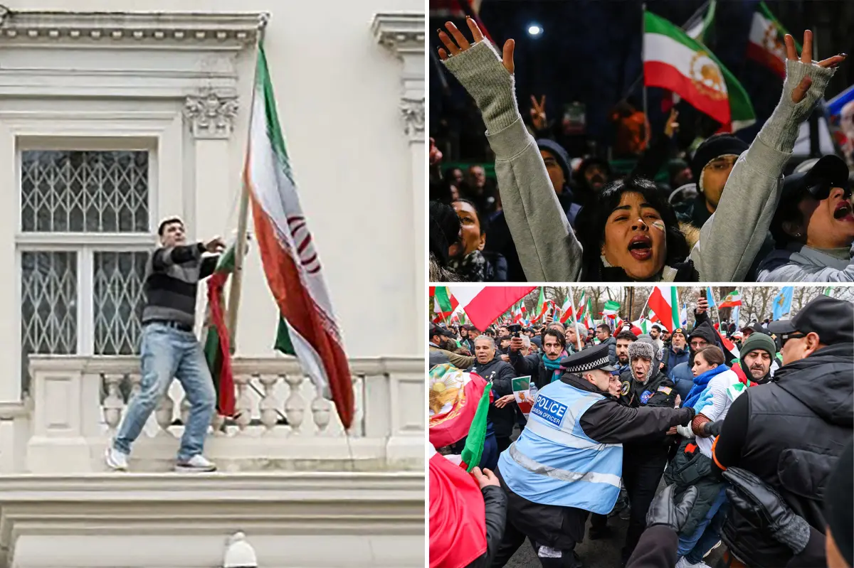Demonstrator climbs Iranian Embassy in London, removes regime flag, raises pre-revolution emblem
