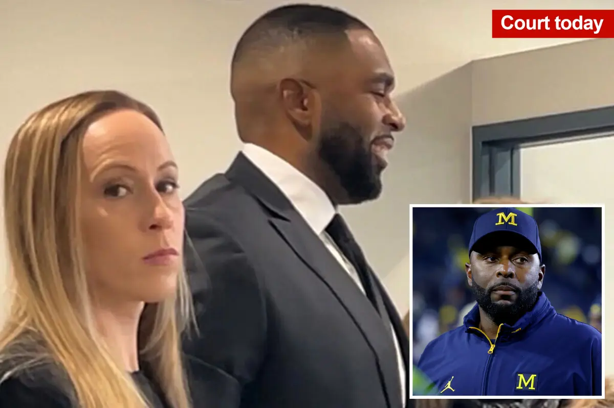 Embattled Michigan coach Sherrone Moore laughs in court while his wife Kelli looks on with anger after cheating scandal