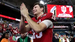 Fernando Mendoza from Indiana marks national title alongside priests