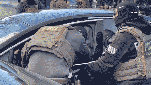 Footage captures woman being removed from vehicle by ICE agents in Minnesota.