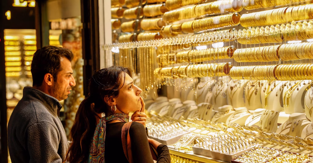 Gold increases as investors look for safety due to uncertainty in US policies.