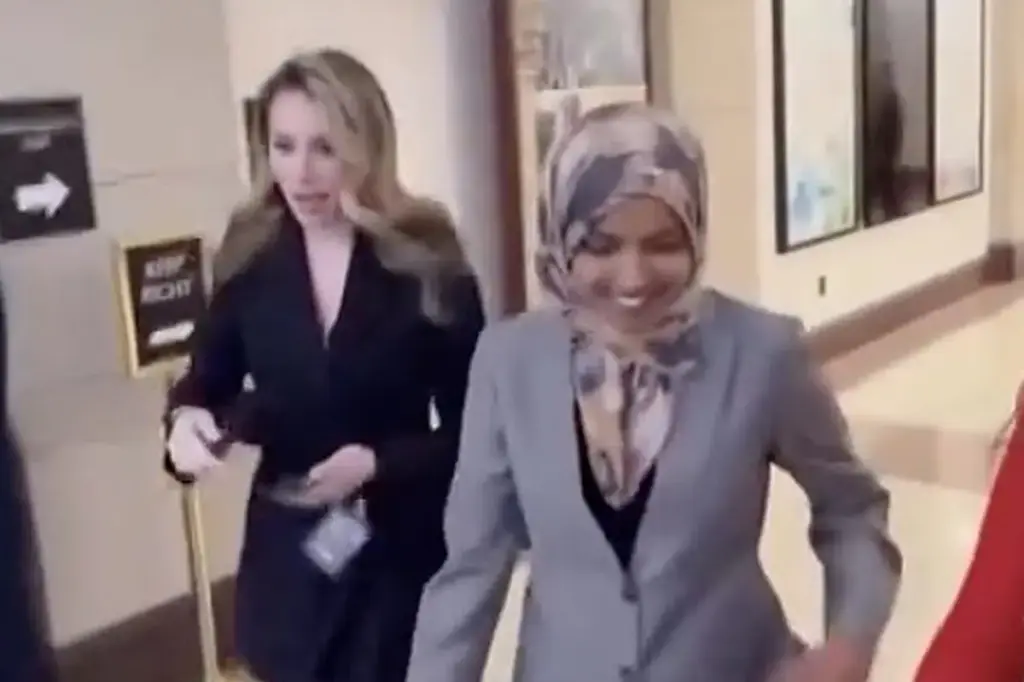 Ilhan Omar responds to Somali fraud claim with laughter while criticizing a female reporter.