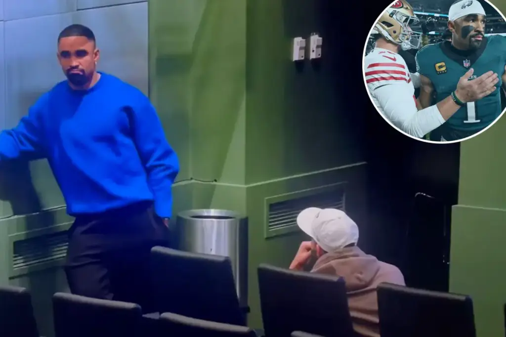 Jalen Hurts shares a brief message with Nick Sirianni following the Eagles' disappointing playoff defeat.