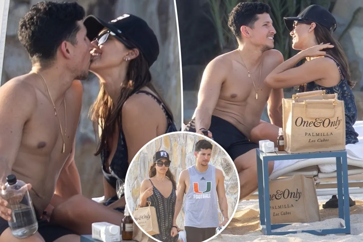 Jessica Alba and Danny Ramirez share a kiss while on vacation at a beach in Mexico.
