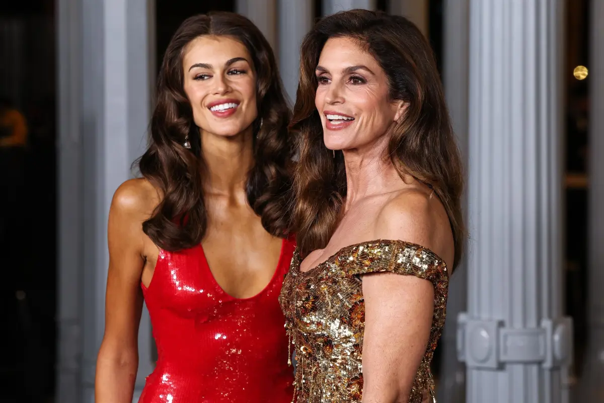 Kaia Gerber shares that nude pictures of her mother Cindy Crawford decorated her childhood home.