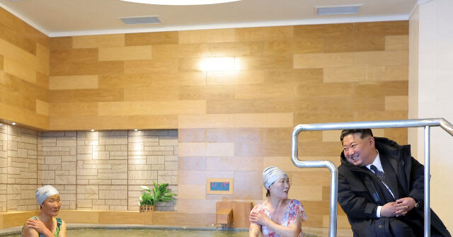 Kim Jong-un, in a Large Coat, Engages with Guests in Swimsuits at a Hot Spring Resort