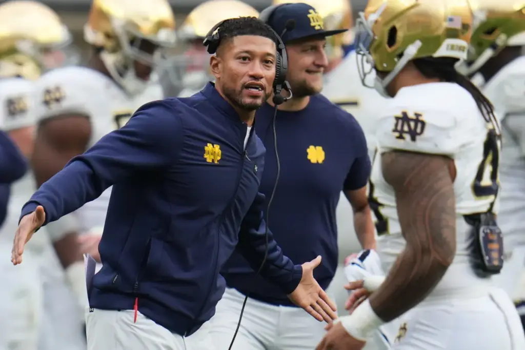 Marcus Freeman faces battery allegations from a wrestling coach at Notre Dame.