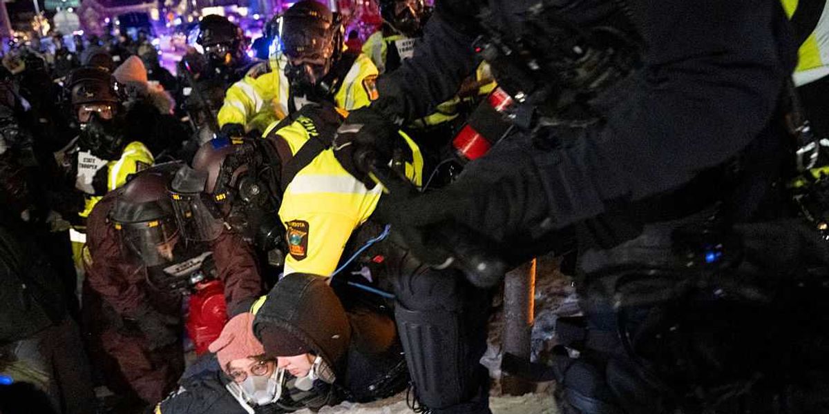 Minnesota police respond to violent anti-ICE protesters with tear gas and arrests outside a hotel believed to be sheltering federal agents