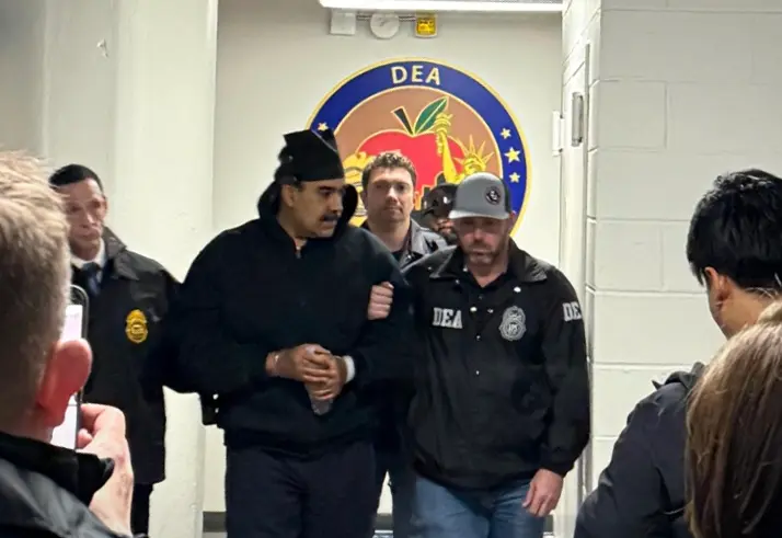 Nicolás Maduro, wearing handcuffs, arrives at a DEA office in NYC to stand trial.