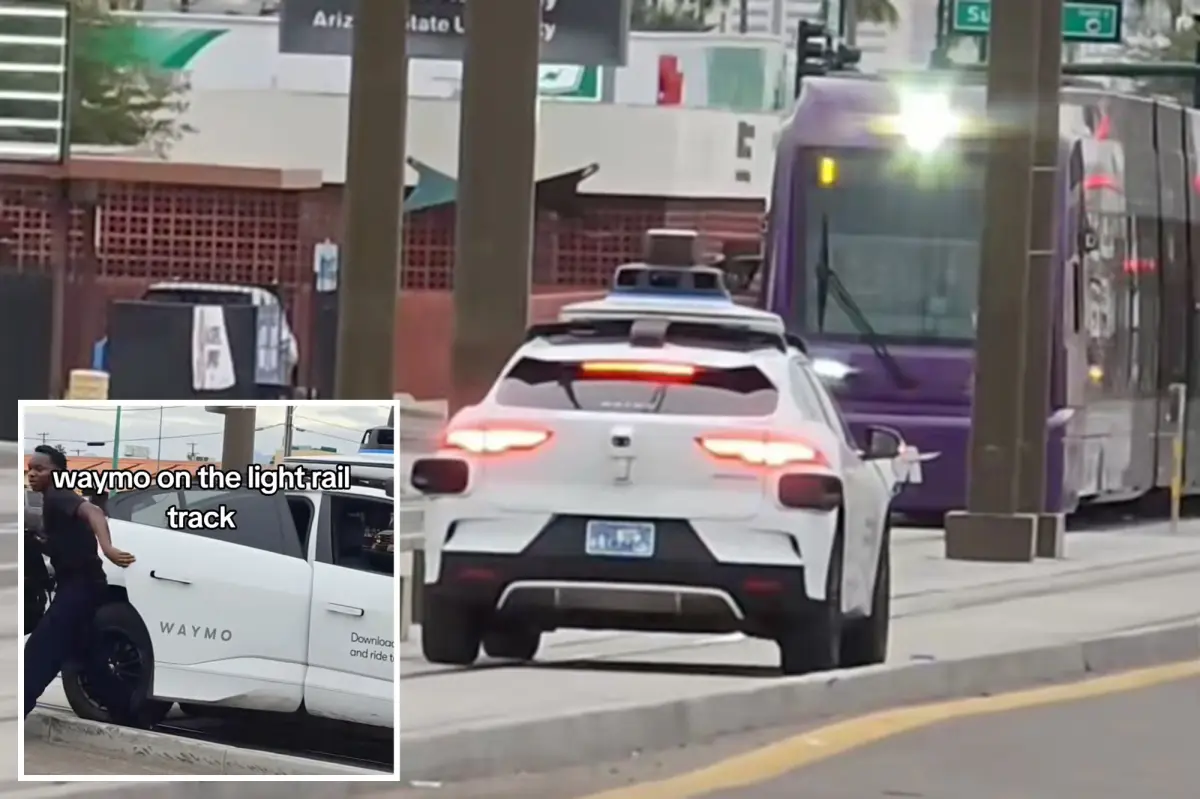 Passenger escapes as self-driving car becomes immobilized on tracks by an approaching train