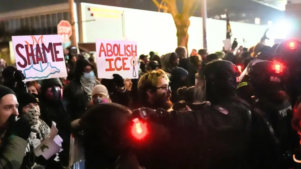 Protesters confront police in riot gear close to ICE facility in Portland