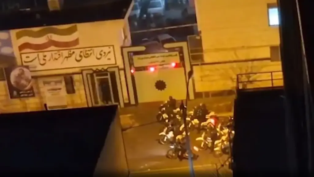 Protesters with weapons confront security forces in Iran as deadly turmoil persists across the country.