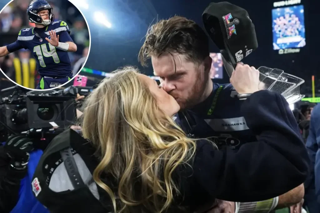 Sam Darnold and his fiancée share a kiss on the field following the Seahawks' NFC Championship victory.