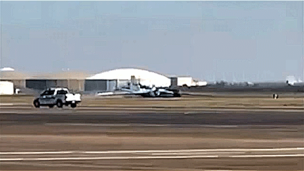 Smoke rises as NASA plane makes landing without its landing gear in Houston.