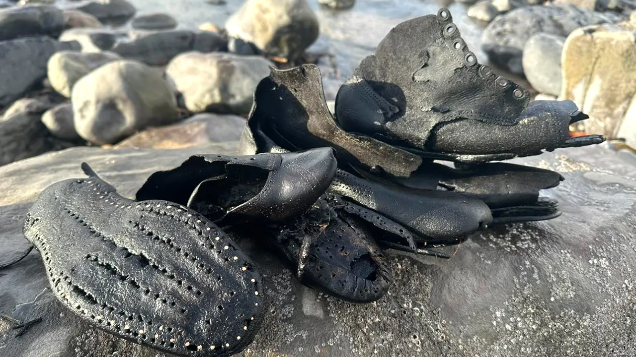 Strange collection of worn shoes appears on beach in Wales, confusing local authorities