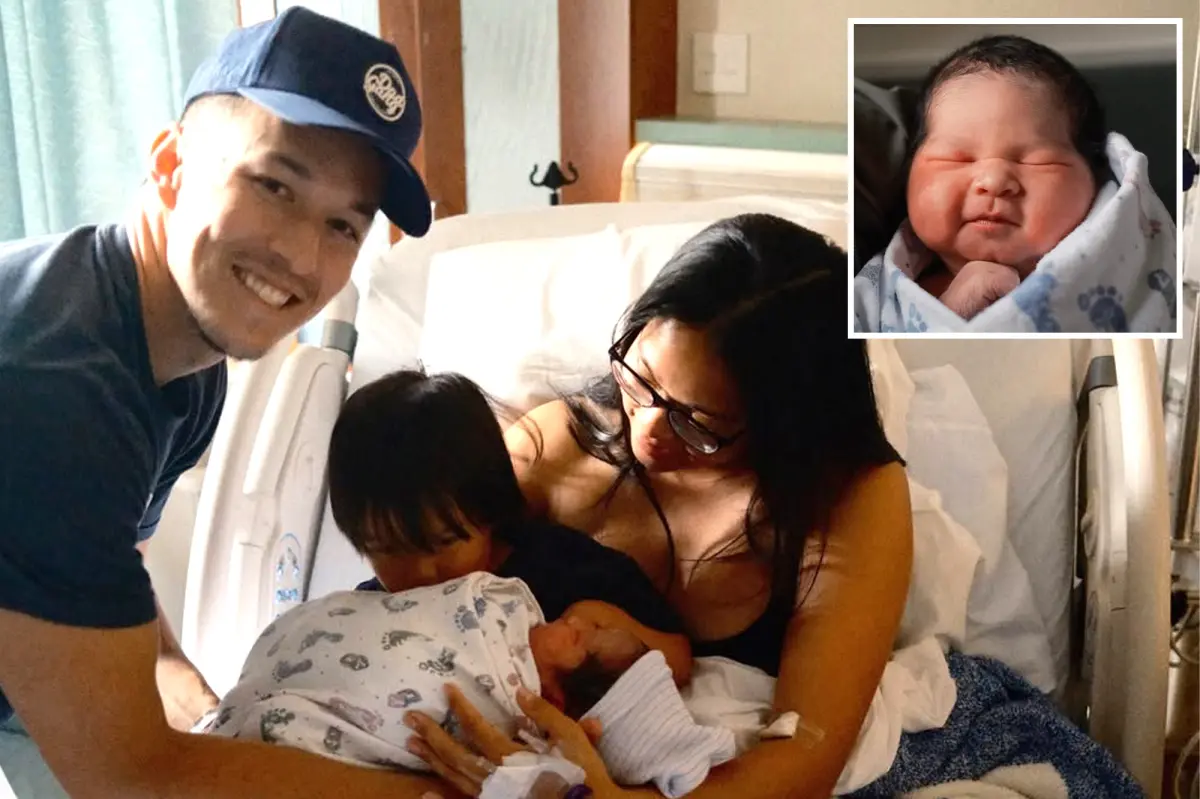 Tommy Edman from the Dodgers celebrates the arrival of his daughter Ava with his wife Kristen in Los Angeles.