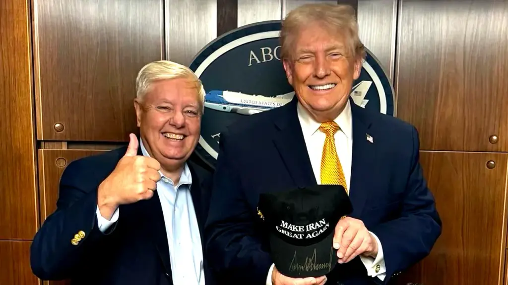 Trump displays a signed 'Make Iran Great Again' hat alongside Sen. Lindsey Graham