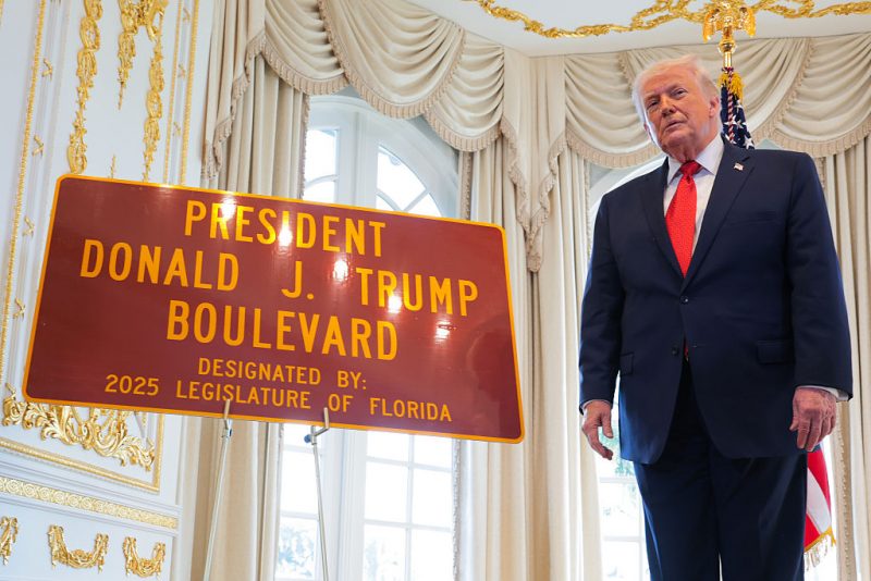 Trump takes part in a ceremony to rename the road from Palm Beach International Airport to Mar-a-Lago in his honor.