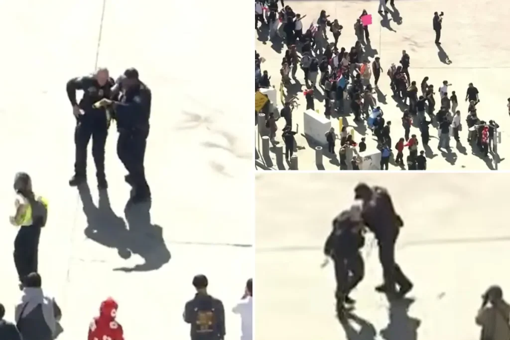 Agent hurt as students protesting ICE are seen hitting officers with a pole in downtown Los Angeles confrontation