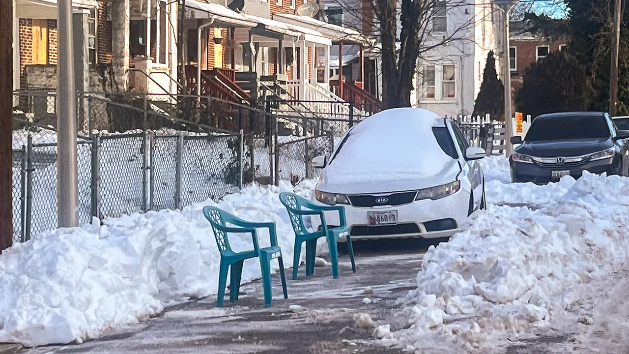 Authorities caution that it is against the law to use parking 'space savers' after clearing snow.