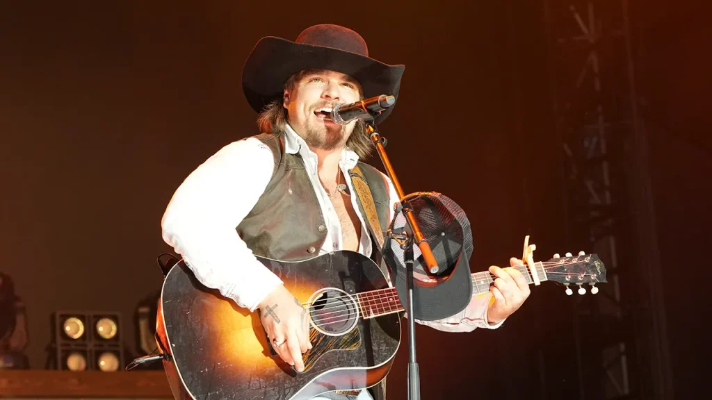 Country singer Gavin Adcock backs Turning Point USA's halftime event.