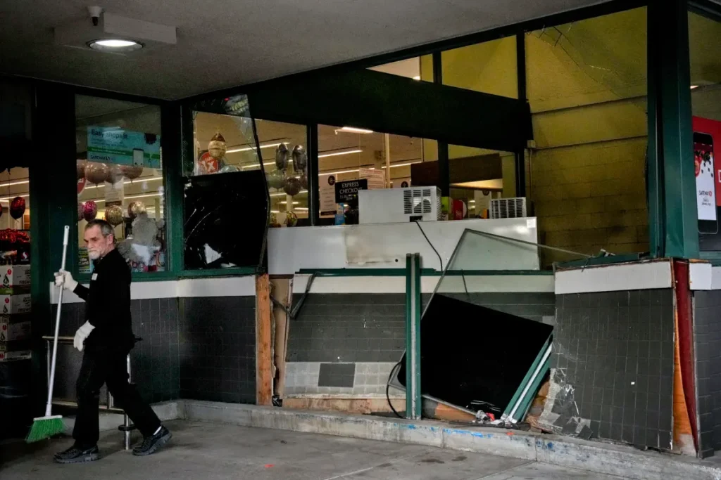 Four people hurt when a man drives his car into a grocery store in California.